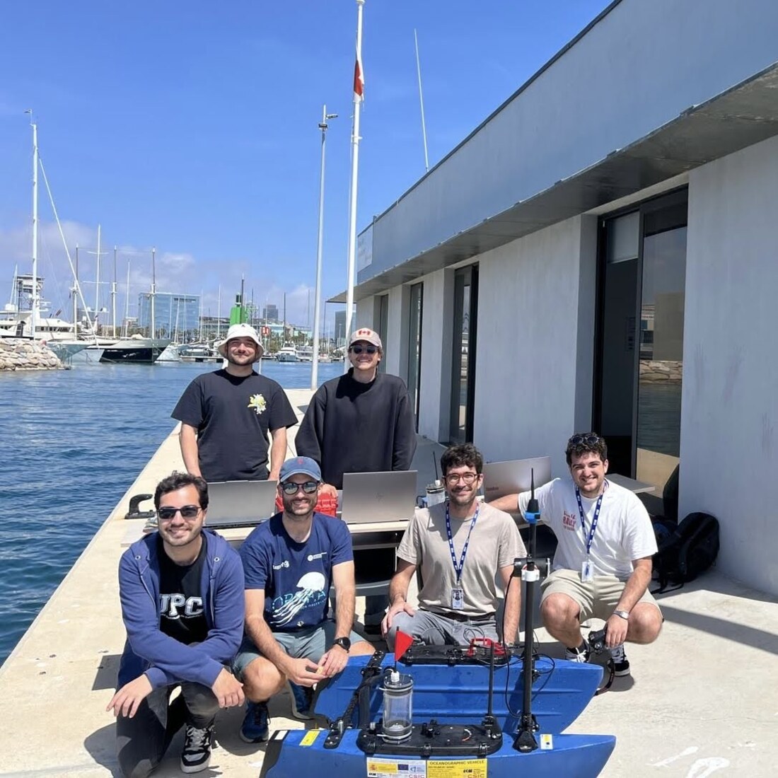 The ICM-CSIC team on the dock with the BlueBoat ASV in Barcelona harbour